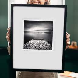 Art and collection photography Denis Olivier, Paved Ramp, Etude 2, Lake Maggiore, Italy. August 2014. Ref-11534 - Denis Olivier Art Photography, original 9 x 9 inches fine-art photograph print in limited edition and signed hold by a galerist woman