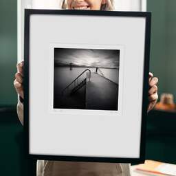 Art and collection photography Denis Olivier, Pier And Diving Tower, Geneva Lake, Switzerland. August 2014. Ref-1293 - Denis Olivier Photography, original 9 x 9 inches fine-art photograph print in limited edition and signed hold by a galerist woman