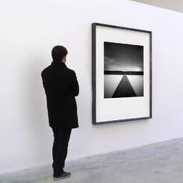 Art and collection photography Denis Olivier, Polder Line, Netherlands, Netherlands. April 2015. Ref-1310 - Denis Olivier Art Photography, A visitor contemplate a large original photographic art print in limited edition and signed in a black frame