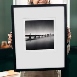 Art and collection photography Denis Olivier, Pont De Pierre Bridge And St. Michael Basilica Tower, Bordeaux, France. September 2020. Ref-1365 - Denis Olivier Photography, original 9 x 9 inches fine-art photograph print in limited edition and signed hold by a galerist woman
