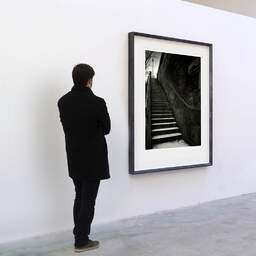 Art and collection photography Denis Olivier, Quay Stairs, Etude 2, Port Debilly, Paris, France. February 2022. Ref-11664 - Denis Olivier Photography, A visitor contemplate a large original photographic art print in limited edition and signed in a black frame