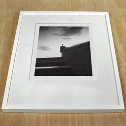 Art and collection photography Denis Olivier, Rampart Shelter, Edinburgh Castle, Scotland. August 2022. Ref-11689 - Denis Olivier Art Photography, white frame on a wooden table