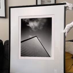 Art and collection photography Denis Olivier, Roof, La Madeleine, France. November 2022. Ref-11620 - Denis Olivier Photography, large original 9 x 9 inches fine-art photograph print in limited edition and signed hold by a galerist woman