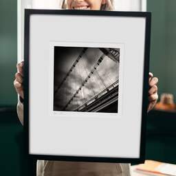 Art and collection photography Denis Olivier, Rouergue Bridge, La Reole, France. January 2006. Ref-853 - Denis Olivier Photography, original 9 x 9 inches fine-art photograph print in limited edition and signed hold by a galerist woman