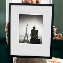 Art and collection photography Denis Olivier, Seagull Over The Man, Trocadéro Garden, Paris, France. February 2023. Ref-11656 - Denis Olivier Photography, original 9 x 9 inches fine-art photograph print in limited edition and signed hold by a galerist woman