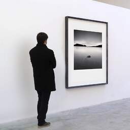 Art and collection photography Denis Olivier, Servières Lake, Etude 1, Puy-de-Dôme, France. December 2021. Ref-11561 - Denis Olivier Art Photography, A visitor contemplate a large original photographic art print in limited edition and signed in a black frame