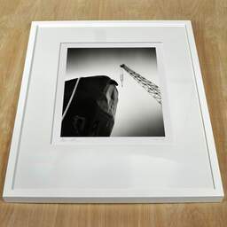 Art and collection photography Denis Olivier, Ship Hull And Crane, Bacalan Docks, Bordeaux, France. July 2022. Ref-11660 - Denis Olivier Photography, white frame on a wooden table