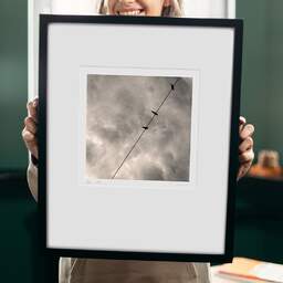 Art and collection photography Denis Olivier, Sky Line, Pyrénées, France. August 1990. Ref-929 - Denis Olivier Art Photography, original 9 x 9 inches fine-art photograph print in limited edition and signed hold by a galerist woman