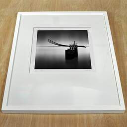 Art and collection photography Denis Olivier, Slavery Abolition Monument, Etude 1, Saint-Nazaire, France. August 2020. Ref-1354 - Denis Olivier Art Photography, white frame on a wooden table
