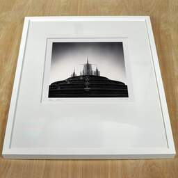 Art and collection photography Denis Olivier, Star Wars Hyperspace Mountain Dome, Disneyland Paris, Chessy, France. February 2022. Ref-11523 - Denis Olivier Photography, white frame on a wooden table