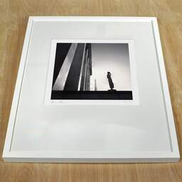 Art and collection photography Denis Olivier, Statue And Eiffel Tower, Trocadero, Paris, France. February 2022. Ref-11531 - Denis Olivier Photography, white frame on a wooden table