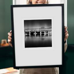Art and collection photography Denis Olivier, Submarine Base, Saint-Nazaire, France. August 2020. Ref-1352 - Denis Olivier Photography, original 9 x 9 inches fine-art photograph print in limited edition and signed hold by a galerist woman