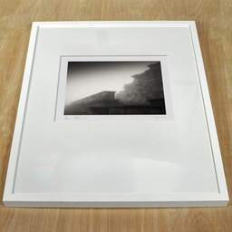 Art and collection photography Denis Olivier, Temple Of Mercury, Puy-de-Dôme, France. December 2021. Ref-11601 - Denis Olivier Art Photography, white frame on a wooden table