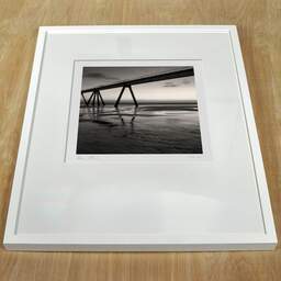 Art and collection photography Denis Olivier, The Dividing Line II, Wharf, La Salie-south, France. July 2005. Ref-704 - Denis Olivier Photography, white frame on a wooden table