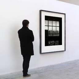 Art and collection photography Denis Olivier, Tokyo Skyview, Saint Luke's Garden Tower, Japan. July 2014. Ref-11638 - Denis Olivier Art Photography, A visitor contemplate a large original photographic art print in limited edition and signed in a black frame