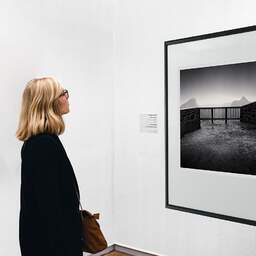 Art and collection photography Denis Olivier, Tuilière And Sanadoire Rocks, Monts Dore, Puy-de-Dôme, France. December 2021. Ref-11520 - Denis Olivier Art Photography, A woman contemplate a large original photographic art print in limited edition and signed in a black frame