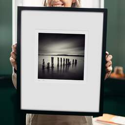 Art and collection photography Denis Olivier, Twelve Poles, Bunchrew House, Beauly Firth, Scotland. April 2006. Ref-956 - Denis Olivier Photography, original 9 x 9 inches fine-art photograph print in limited edition and signed hold by a galerist woman