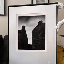 Art and collection photography Denis Olivier, Two Chimneys, Edinburgh, Scotland. August 2022. Ref-11616 - Denis Olivier Photography, large original 9 x 9 inches fine-art photograph print in limited edition and signed hold by a galerist woman