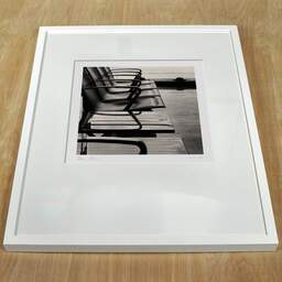 Art and collection photography Denis Olivier, Waiting For The Next Flight, Bordeaux International Airport, France. April 2003. Ref-734 - Denis Olivier Art Photography, white frame on a wooden table