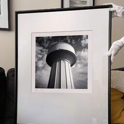 Art and collection photography Denis Olivier, Water Tower, Haut-Brion, Pessac, France. October 2022. Ref-11598 - Denis Olivier Photography, large original 9 x 9 inches fine-art photograph print in limited edition and signed hold by a galerist woman