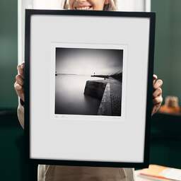 Art and collection photography Denis Olivier, West Jetty, Etude 1, Sant-Nazaire, France. November 2021. Ref-11545 - Denis Olivier Photography, original 9 x 9 inches fine-art photograph print in limited edition and signed hold by a galerist woman