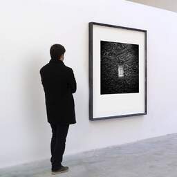 Art and collection photography Denis Olivier, Window, Royan, France. May 2021. Ref-11452 - Denis Olivier Art Photography, A visitor contemplate a large original photographic art print in limited edition and signed in a black frame
